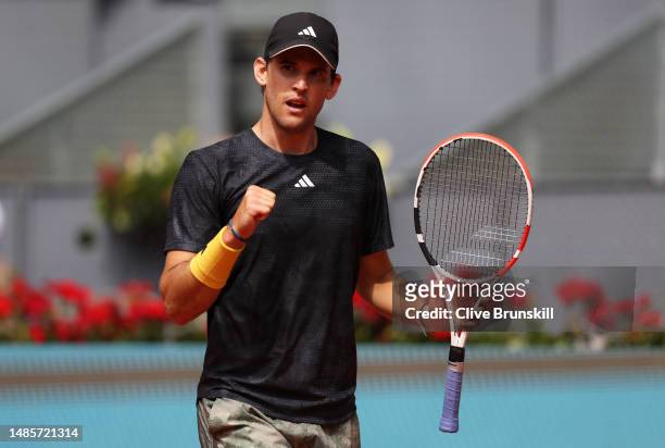 Dominic Thiem of Austria celebrates a point against Kyle Edmund of Great Britain during their first round match on day four of the Mutua Madrid Open...