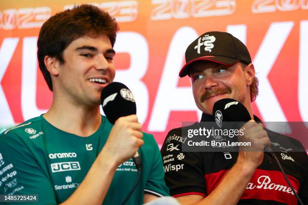 Lance Stroll of Canada and Aston Martin F1 Team and Valtteri Bottas of Finland and Alfa Romeo F1 talk in a press conference during previews ahead of...