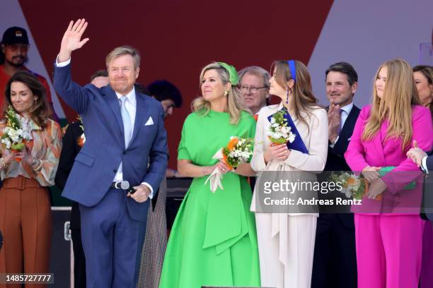 King Willem-Alexander of The Netherlands waves to the crowd as Queen Maxima of The Netherlands, Princess Ariane of The Netherlands and Princess...