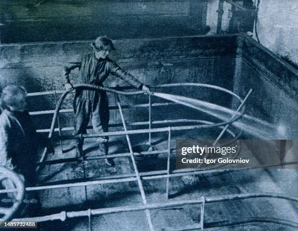 Cleaning brewery vats at Burton-on-Trent - photo from 'Great War' magazine, vol. 156, UK, circa 1917.