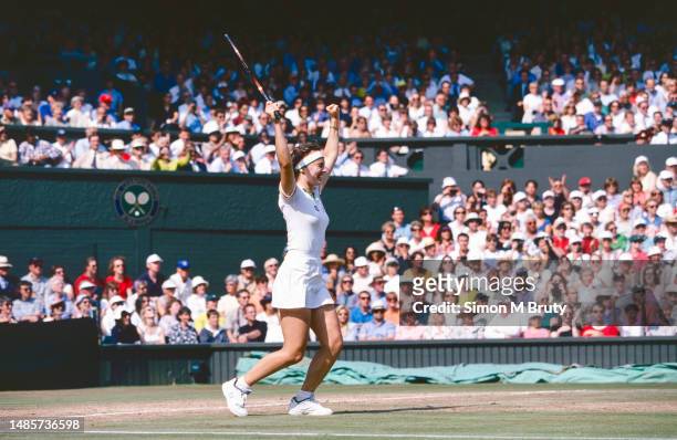 Martina Hingis of Switzerland celebrates defeating Jana Novotna of Czech Republic during the Women's Single Final at The Wimbledon Lawn Tennis...