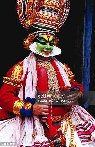 kathakali dancer in full make-up and costume. - kathakali stock pictures, royalty-free photos & images