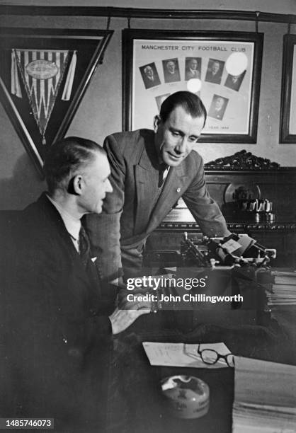 Les McDowall manager of Manchester City F.C., in an office at at Maine Road, February 1951. After a recent relegation, the team is working to gain...