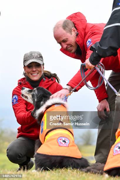 Catherine, Princess of Wales and Prince William, Prince of Wales meet with a Search Dog on the Mountain Rescue Team during a visit to Central Beacons...