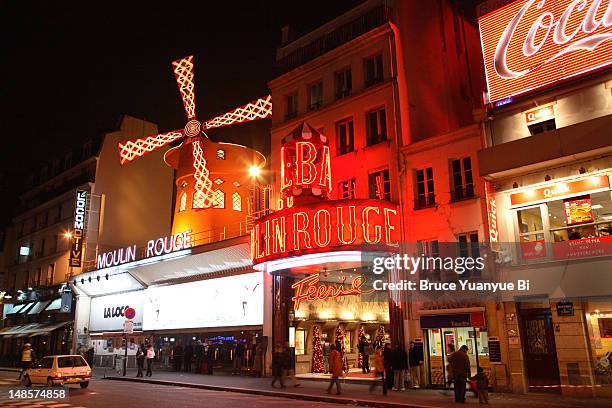 illuminated exterior of moulin rouge nightclub. - moulin rouge bildbanksfoton och bilder