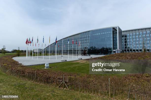 The 31 flags of the NATO member states are seen at the NATO headquarters building on April 27, 2023 in Brussels, Belgium. The European Union bodies...