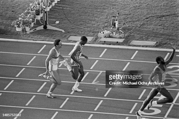 German athlete Harald Schmid finishes behind American athlete Danny Harris, and the winner, American athlete Edwin Moses, in the final of the men's...