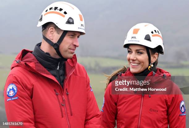 Prince William, Prince of Wales and Catherine, Princess of Wales smile during their visit at the Central Beacons Mountain Rescue on day one of their...