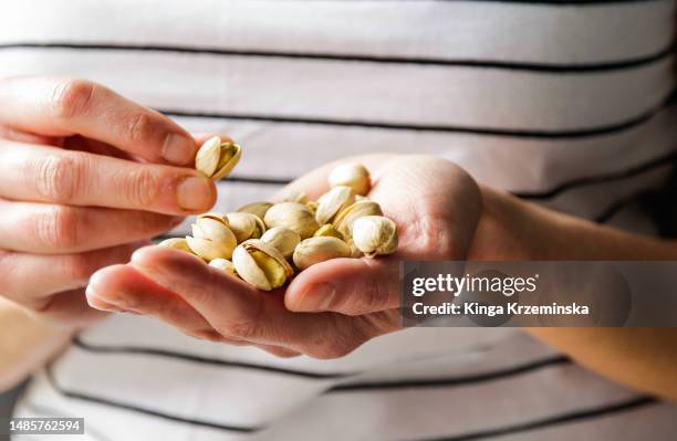 pistachios - handful stock pictures, royalty-free photos & images