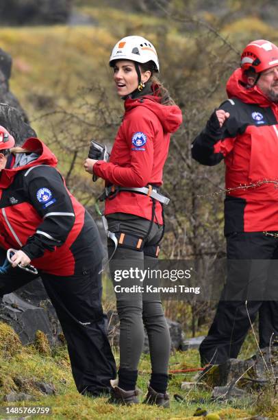 Catherine, Princess of Wales takes part in abseiling as part of training activities during a visit to Central Beacons Mountain Rescue Team during a 2...