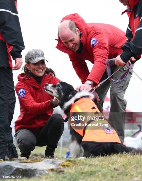 Prince William, Prince of Wales and Catherine, Princess of Wales meet the Central Beacons Mountain Rescue Team search dogs at Morlais Quarry while...