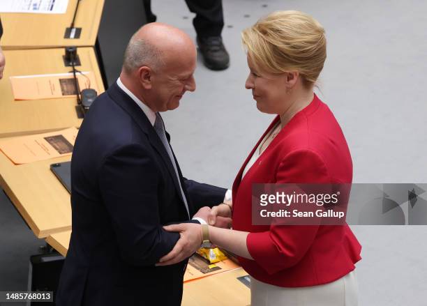 German Christian Democrat and new Berlin Governing Mayor Kai Wegner is congratulated by outgoing Governing Mayor and German Social Democrat Franziska...