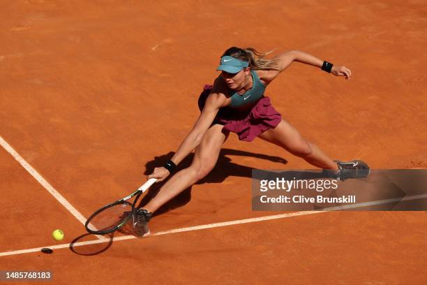 Paula Badosa of Spain plays a backhand against Elisabetta Cocciaretto of Italy during the Women's Singles Second Round match on Day Four of the Mutua...