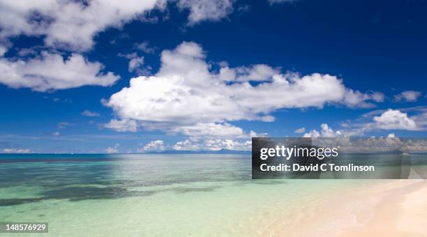 island of mahe from anse saint sauveur. - anse saint sauveur stock pictures, royalty-free photos & images