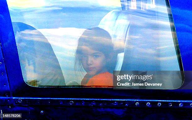 Suri Cruise leaves Manhattan by helicopter at the West Side Heliport on July 18, 2012 in New York City.