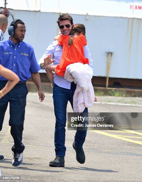 Tom Cruise and Suri Cruise leave Manhattan by helicopter at the West Side Heliport on July 18, 2012 in New York City.