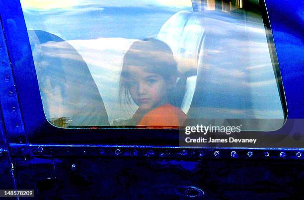 Suri Cruise leaves Manhattan by helicopter at the West Side Heliport on July 18, 2012 in New York City.