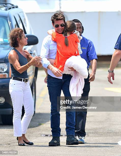 Tom Cruise and Suri Cruise leave Manhattan by helicopter at the West Side Heliport on July 18, 2012 in New York City.