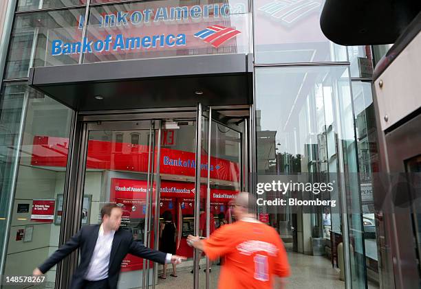 Customers use the ATMs at a Bank of America Corp. Branch in New York, U.S., on Wednesday, July 18, 2012. Bank of America Corp., the second- biggest...