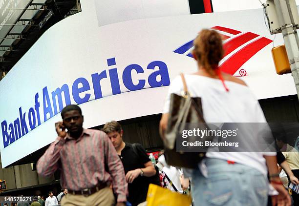 Pedestrians walk past a Bank of America Corp. Branch in New York, U.S., on Wednesday, July 18, 2012. Bank of America Corp., the second- biggest U.S....
