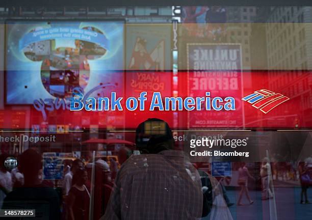 Customers use the ATMs at a Bank of America Corp. Branch in New York, U.S., on Wednesday, July 18, 2012. Bank of America Corp., the second- biggest...