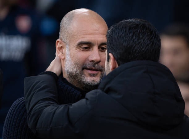 Manchester City manager Pep Guardiola embraces Arsenal manager Mikel Arteta ahead of the Premier League match between Manchester City and Arsenal FC...