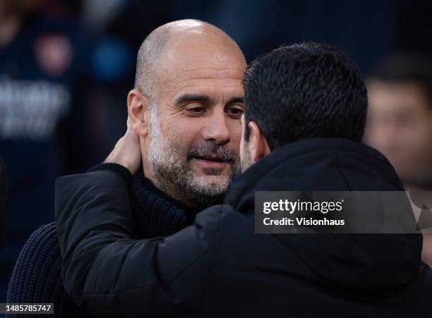 Manchester City manager Pep Guardiola embraces Arsenal manager Mikel Arteta ahead of the Premier League match between Manchester City and Arsenal FC...