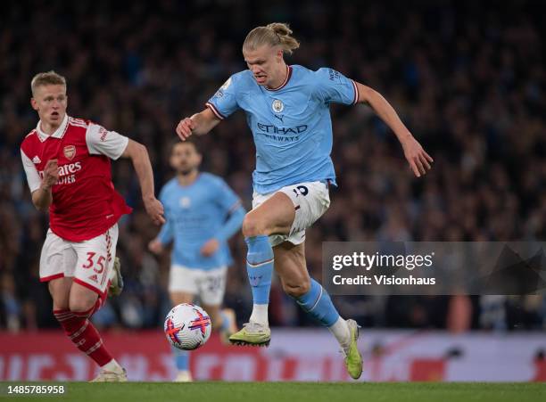 Erling Haaland of Manchester City and Oleksandr Zinchenko of Arsenal in action during the Premier League match between Manchester City and Arsenal FC...