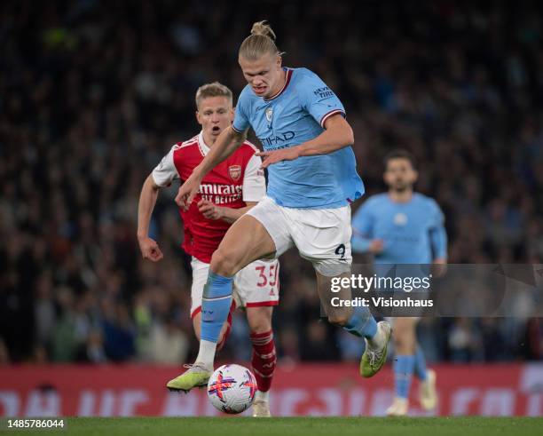 Erling Haaland of Manchester City and Oleksandr Zinchenko of Arsenal in action during the Premier League match between Manchester City and Arsenal FC...