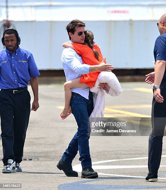 Tom Cruise and Suri Cruise leave Manhattan by helicopter at the West Side Heliport on July 18, 2012 in New York City.