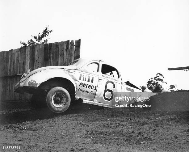 Early-1950s: Marshall Teague knocked down a few boards when he crashed his Modified stock car during a race at the Greensboro Fairgrounds.