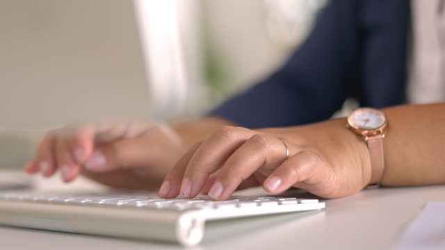Woman, hands and typing on computer in office for data planning, online administration and seo internet update. Closeup worker, desktop keyboard and technology of research, website and business email