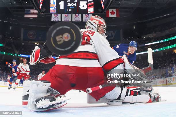 Bo Horvat of the New York Islanders scores a third period goal against Antti Raanta of the Carolina Hurricanes during Game Four in the First Round of...