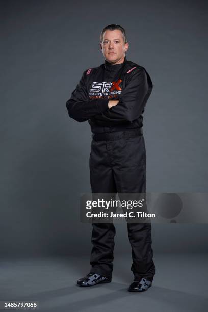 Driver Tony Stewart poses for a photo during the Superstar Racing Experience portrait shoot at Clutch Studios on April 25, 2023 in Huntersville,...