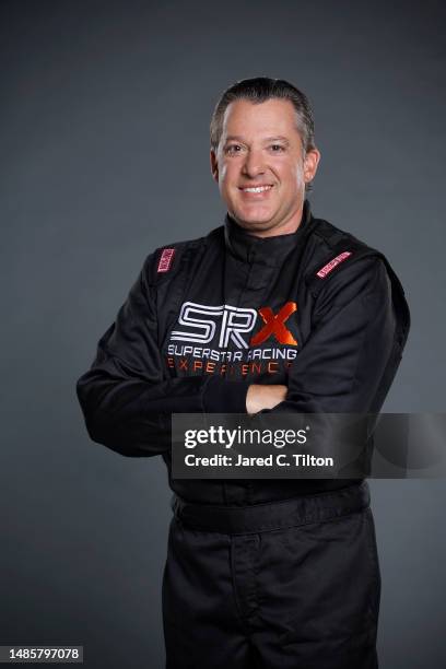 Driver Tony Stewart poses for a photo during the Superstar Racing Experience portrait shoot at Clutch Studios on April 25, 2023 in Huntersville,...