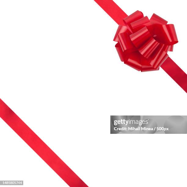 close-up of red toy against white background,oradea,romania - red bow stock pictures, royalty-free photos & images