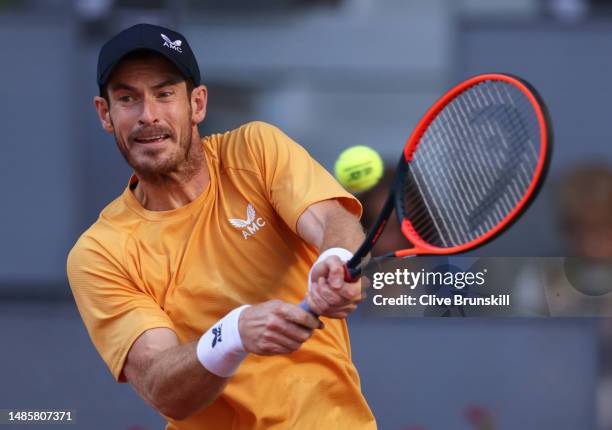 Andy Murray of Great Britain plays a backhand against Andrea Vavassori of Italy during their first round match on day four of the Mutua Madrid Open...