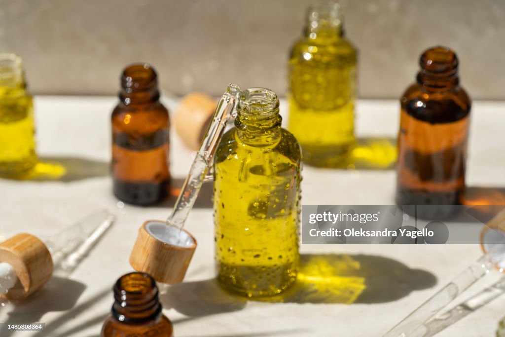 The concept of eco cosmetics packaging. Natural organic skin care for face. Beauty routine. Beautiful splashes in the sun.