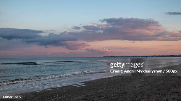 scenic view of beach against sky during sunset,mamaia,romania - mamaia romania stock pictures, royalty-free photos & images