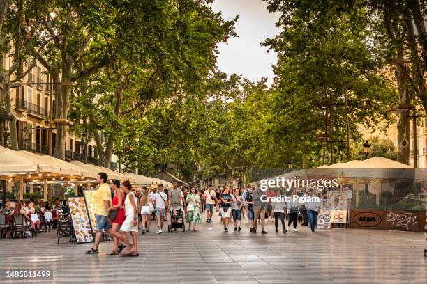 crowds of people walking along la rambla street in barcelona, spain - the ramblas stock pictures, royalty-free photos & images
