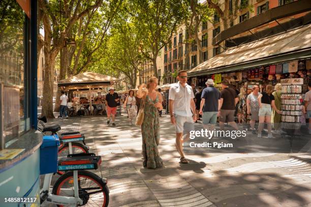 crowds of people walking along la rambla street in barcelona, spain - the ramblas stock pictures, royalty-free photos & images