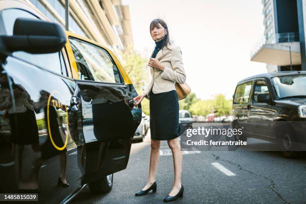 businesswoman taxi ride - uber in buenos aires argentina stock pictures, royalty-free photos & images