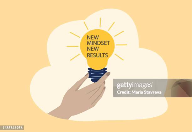 hand holding light bulb with the text new mindset new results. - changing lightbulb stock illustrations