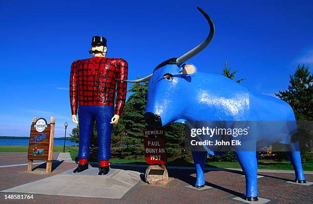 the small lumber town of bemidji has a giant statue of paul bunyan and his faithful blue ox, babe - paul bunyan ox stock pictures, royalty-free photos & images