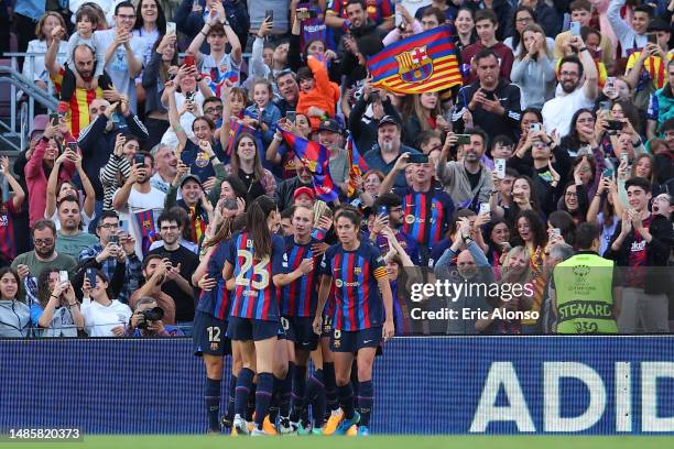 Caroline Graham Hansen of FC Barcelona celebrates with teammates and fans after scoring the team's first goal during the UEFA Women's Champions...