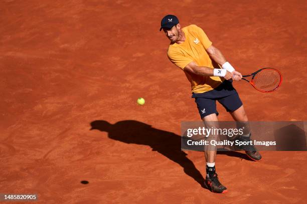 Andy Murray of Great Britain returns the ball against Andrea Vavassori of Italy during their first round match on day four of the Mutua Madrid Open...