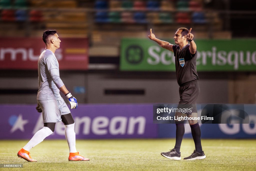 Professional soccer referee orders goalie to back up before a penalty kick is performed