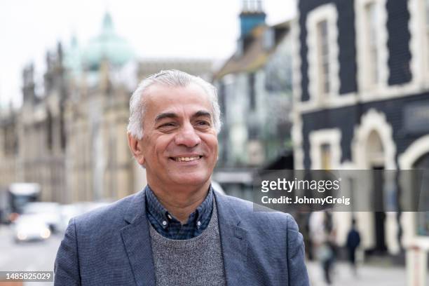 portrait of senior man smiling - 65 stock pictures, royalty-free photos & images