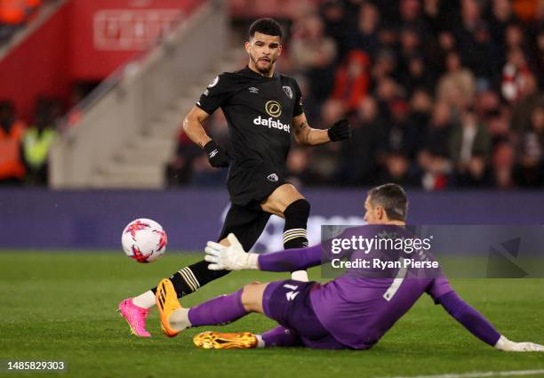 Dominic Solanke of AFC Bournemouth has a shot saved by Alex McCarthy of Southampton during the Premier League match between Southampton FC and AFC...