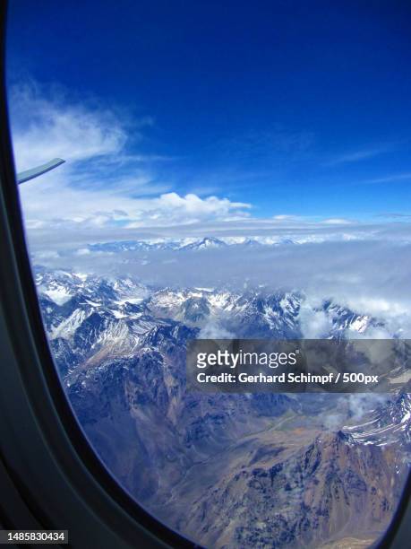 aerial view of snowcapped mountains against sky,chile - gerhard schimpf 個照片及圖片檔